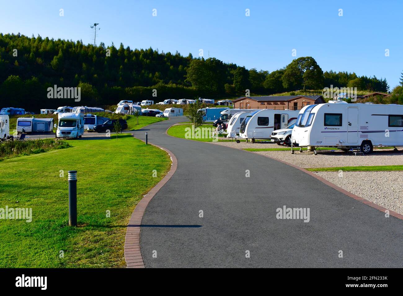 A view of caravans & motorhomes on site at the Red Kite Touring Park close  to Llanidloes in Mid-Wales. Adults-only site with fully serviced pitches  Stock Photo - Alamy