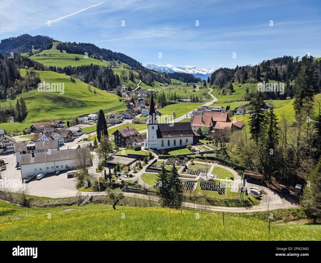 Fischenthal a small village in the Zurich Oberland. Beautiful Toesstal with a wonderful view of the mountains. church Stock Photo