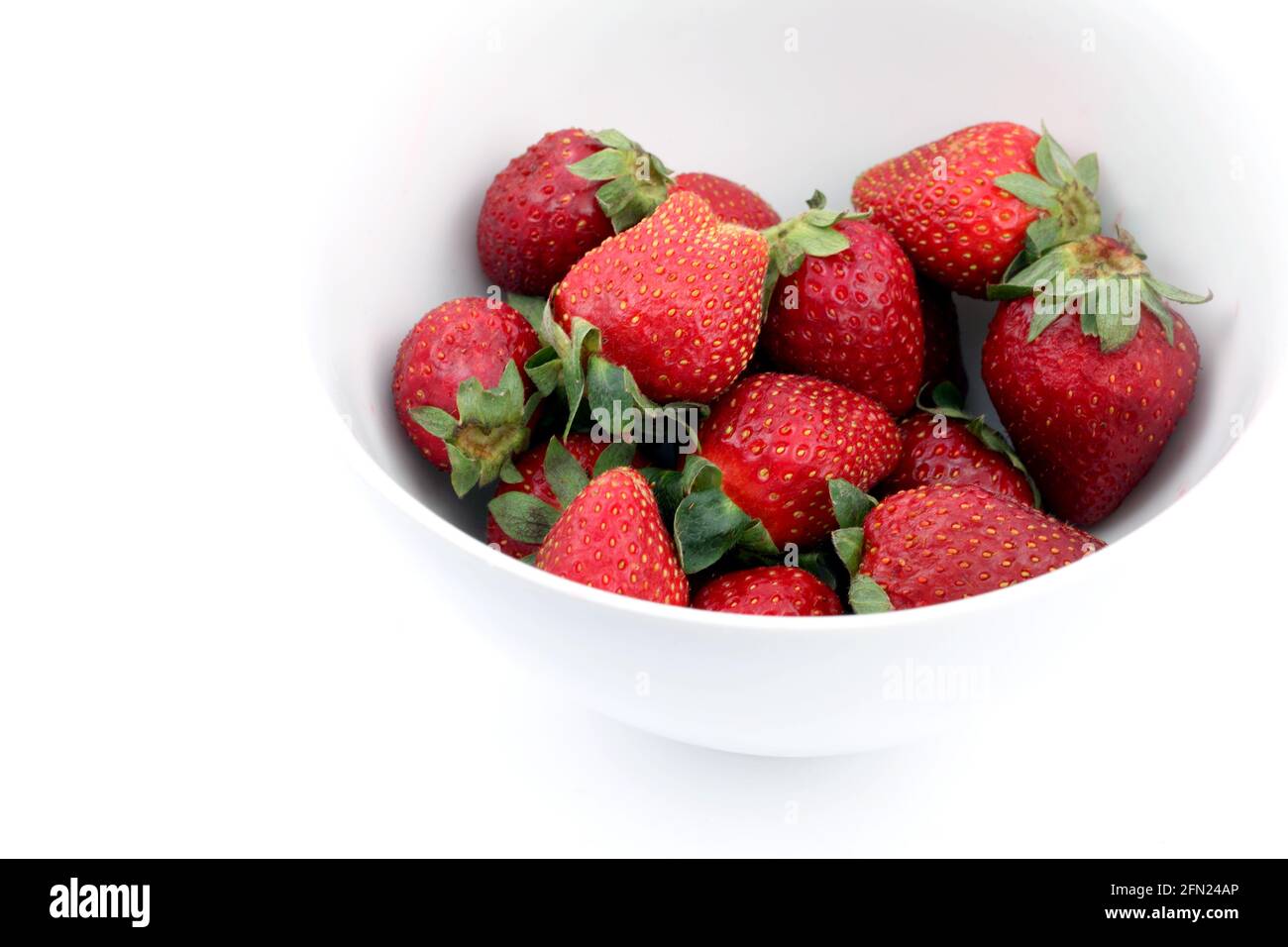 Strawberries in a white bowl isolated on a white background Stock Photo ...