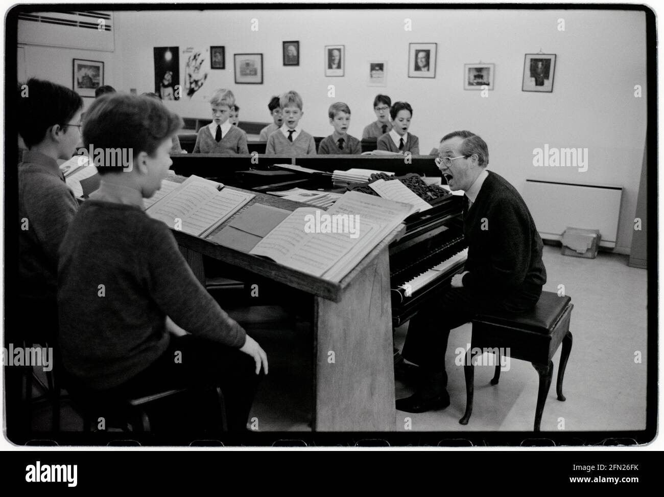 Kings College Chapel Choir December 1992 scanned 2021 Photographed in the lead up to the traditional Festival of Nine Carols in King’s College under the musical directorship of Stephen Cleobury,(seen here) later Sir Stephen. Sire Stephen died in 2019. Sir Stephen John Cleobury CBE was an English organist and music director. He worked with the Choir of King's College, Cambridge, where he served as music director from 1982 to 2019 Stock Photo