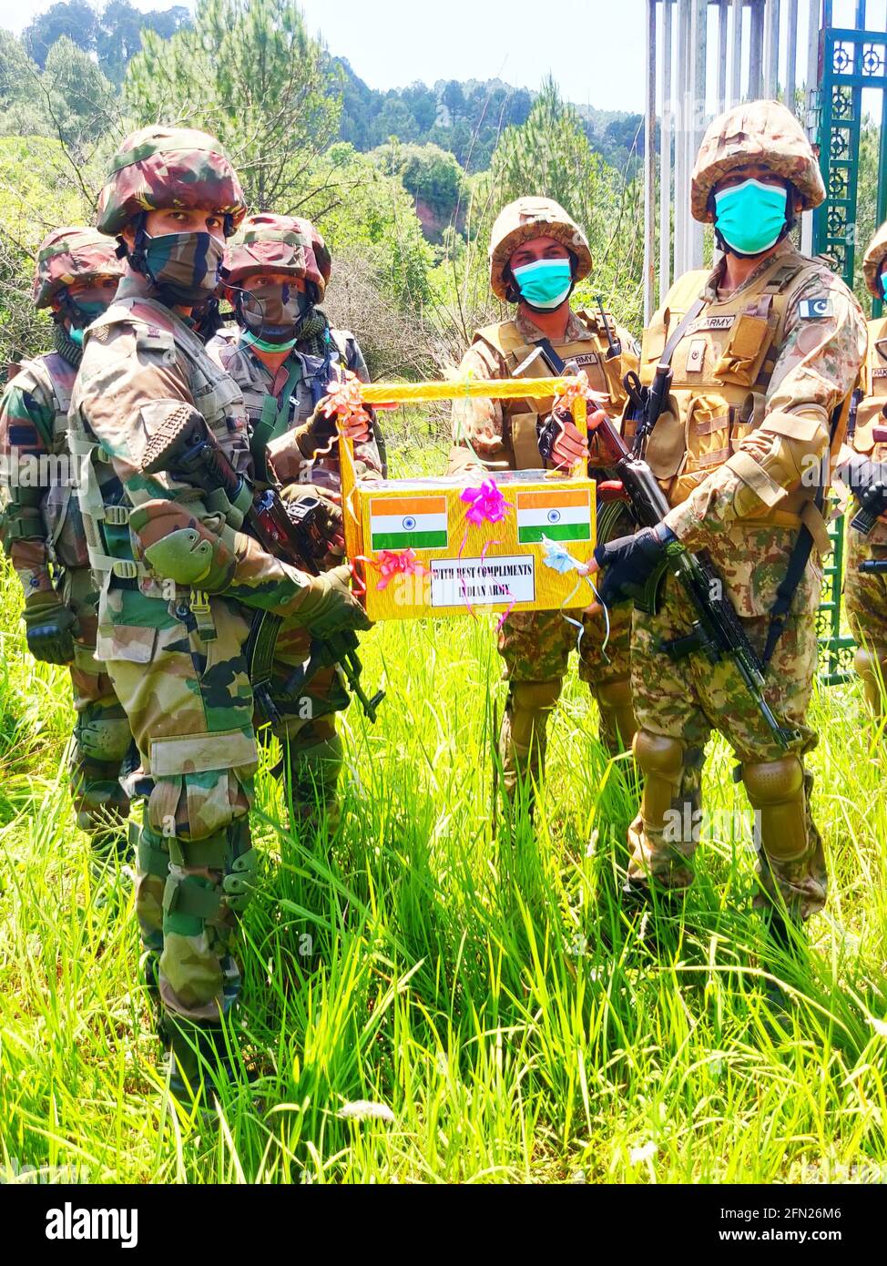 Poonch, Jammu and Kashmir, India. May 13, 2021: Indian Army & Pakistan Army celebrated Eid-ul-Fitr on the Line of Control (LoC) at Poonch-Rawalakot Crossing Point & Mendhar-Hotspring Crossing Point in Poonch district of Jammu & Kashmir on 13 May 21. Sweets and compliments were exchanged by the representatives of both the Armies in an atmosphere of bonhomie & festivities. The ceremony is seen as a confidence building measures in the backdrop of recently agreed ceasefire between both the countries. Credit: ZUMA Press, Inc./Alamy Live News Stock Photo