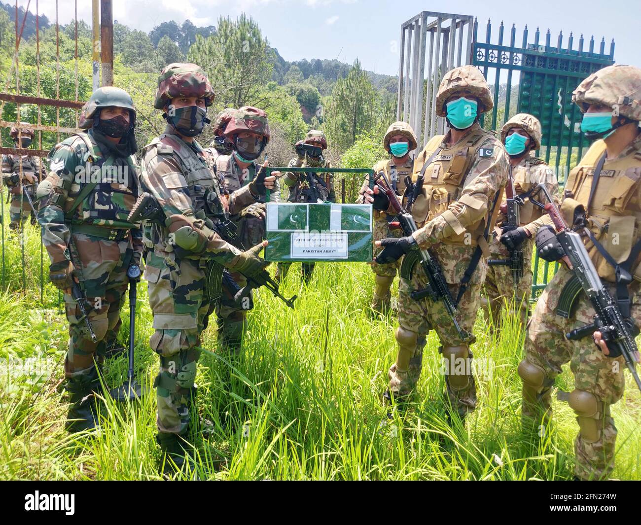 Poonch, Jammu and Kashmir, India. May 13, 2021: Indian Army & Pakistan Army celebrated Eid-ul-Fitr on the Line of Control (LoC) at Poonch-Rawalakot Crossing Point & Mendhar-Hotspring Crossing Point in Poonch district of Jammu & Kashmir on 13 May 21. Sweets and compliments were exchanged by the representatives of both the Armies in an atmosphere of bonhomie & festivities. The ceremony is seen as a confidence building measures in the backdrop of recently agreed ceasefire between both the countries. Credit: ZUMA Press, Inc./Alamy Live News Stock Photo
