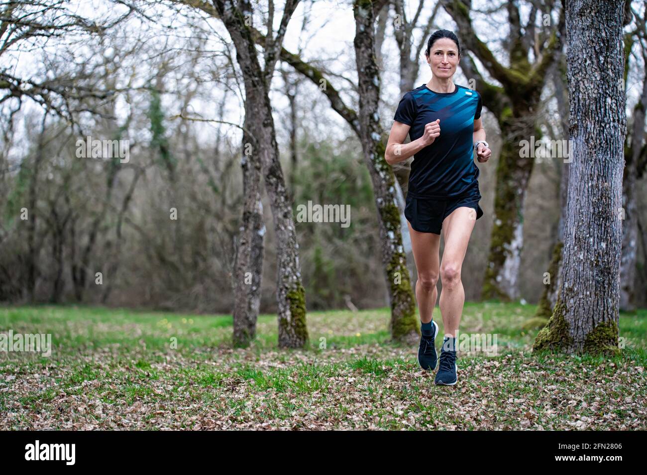 Girl running in nature, it is her healthy and free lifestyle. Stock Photo