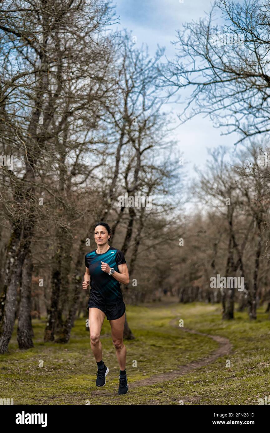 Girl running in nature, it is her healthy and free lifestyle. Stock Photo