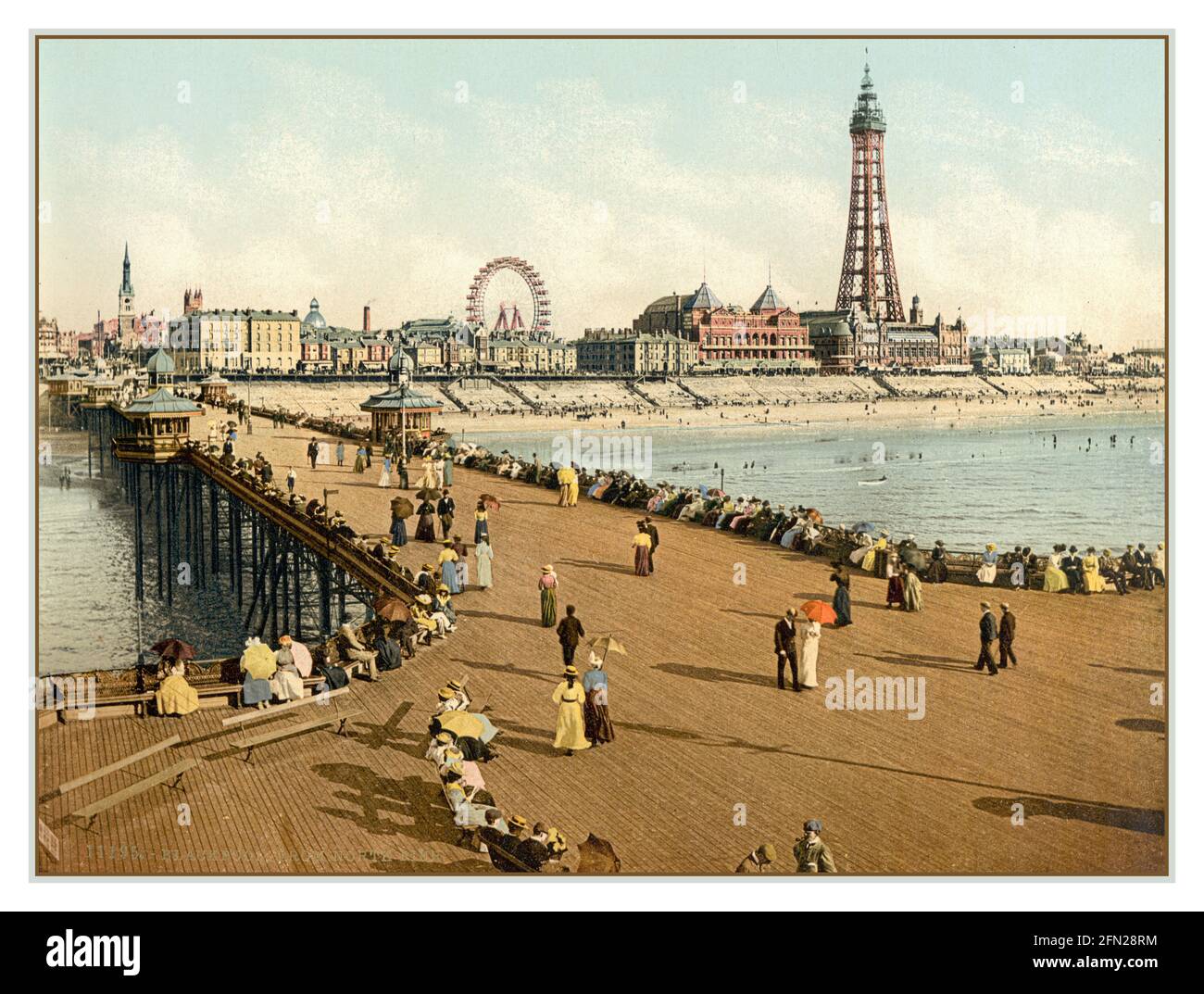 BLACKPOOL PEOPLE VACATION VINTAGE PHOTOCHROM 1890's Blackpool Vintage Retro Chromolith Photochrom Pleasure Beach from North Pier with Blackpool Tower Behind Great Britain UK Stock Photo