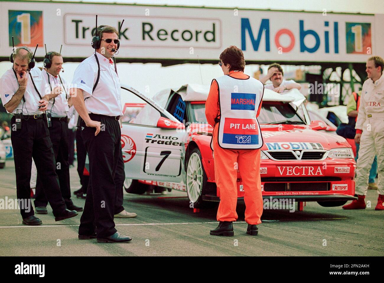 Derek Warwick overseeing Vauxhall Motorsport challenge of the British Touring Car championship of 1999 pictured on the grid at Thruxton Circuit as the cars and drivers prepare for the start of the race. Stock Photo