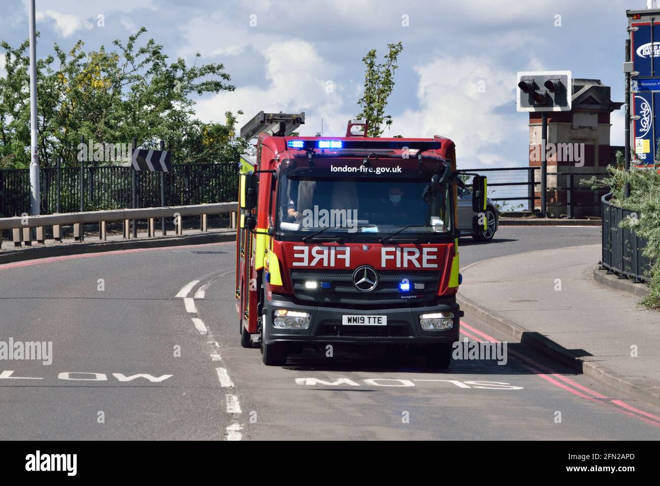 Fire appliance from London Fire Brigade on a blue-light run to attend an incident in East London Stock Photo