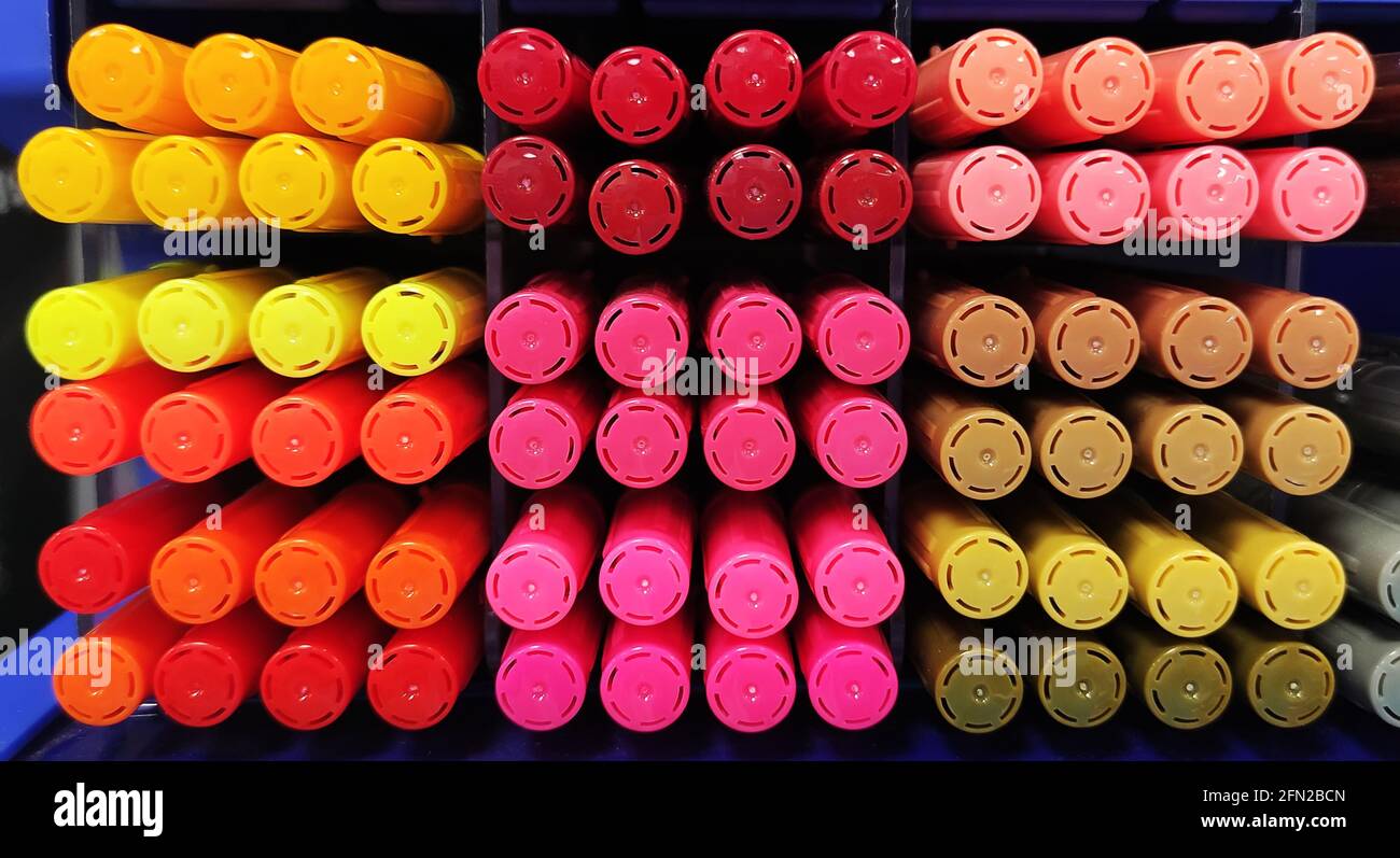 Multi colors highlighter pen line up in slots. A large number of multi