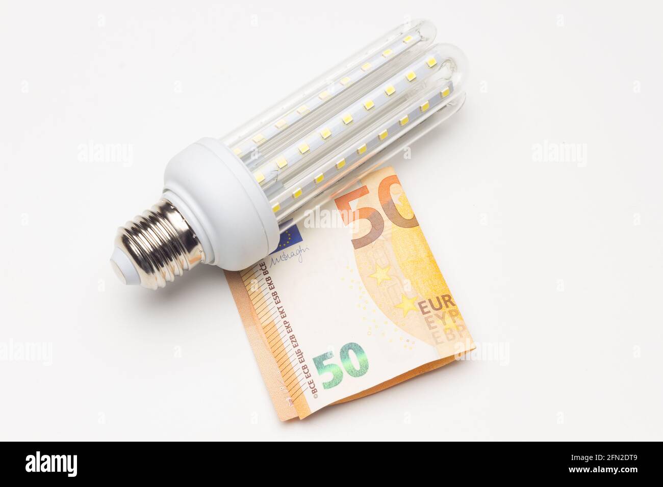 Money and energy-saving light bulbs to money and save from pollution and climate change Stock Photo - Alamy