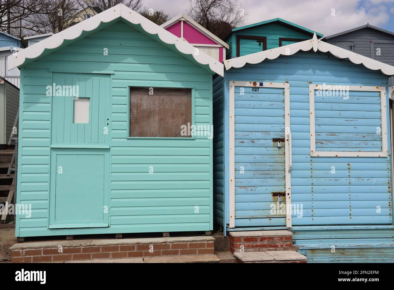 Colourful Beach huts at walton On The Naze Essex UK Stock Photo