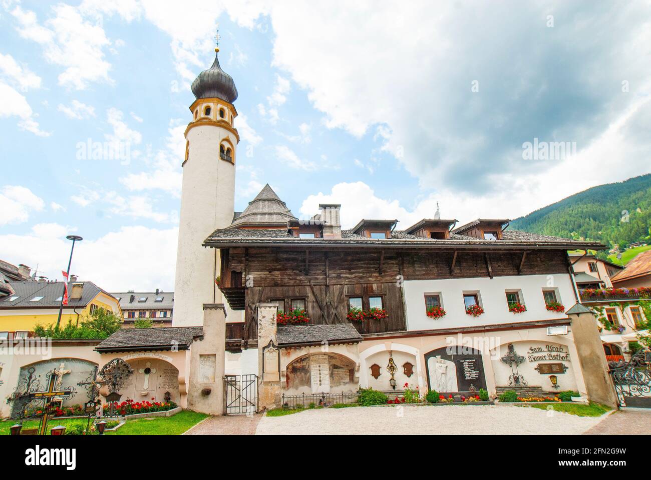 The bell tower of the Church of San Michele from the Graveyard of the Collegiate Church of San Candido, San Candido, Dolomites, Italy, Val Pusteria Stock Photo