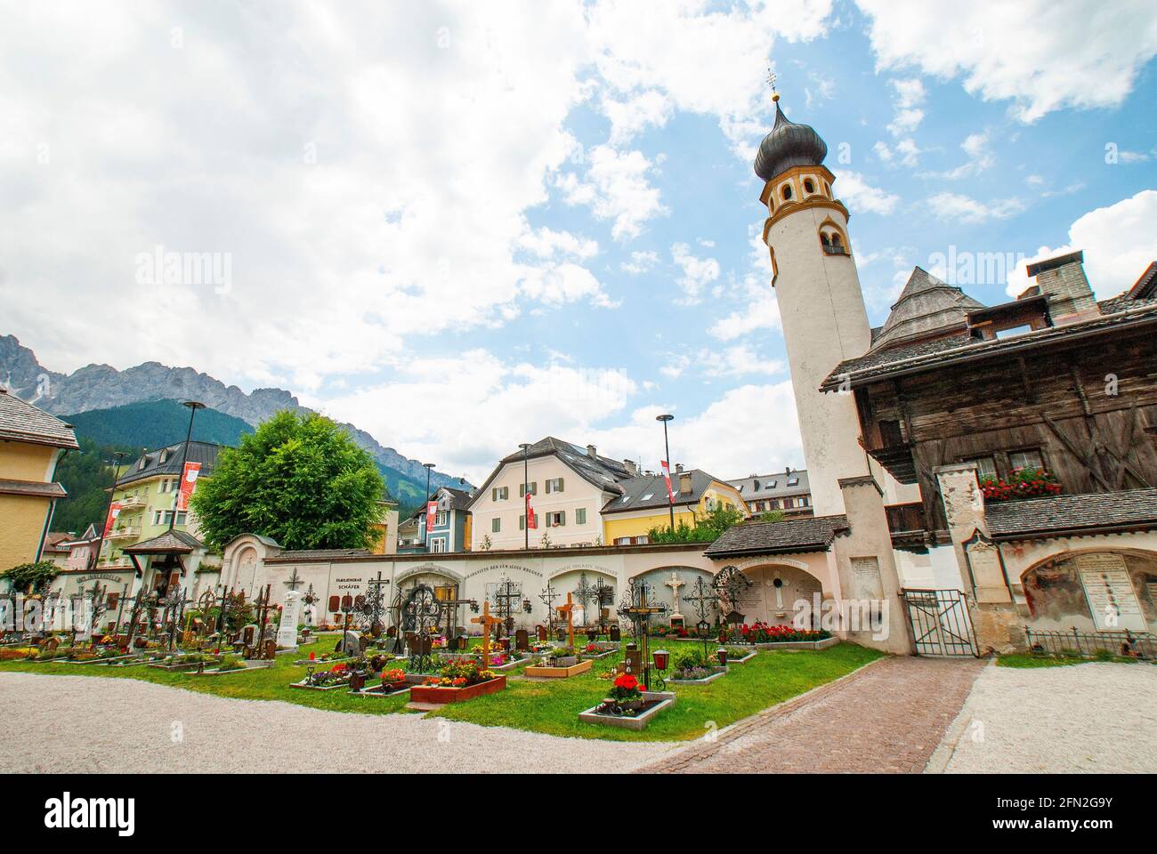 The bell tower of the Church of San Michele from the Graveyard of the Collegiate Church of San Candido, San Candido, Dolomites, Italy, Val Pusteria Stock Photo
