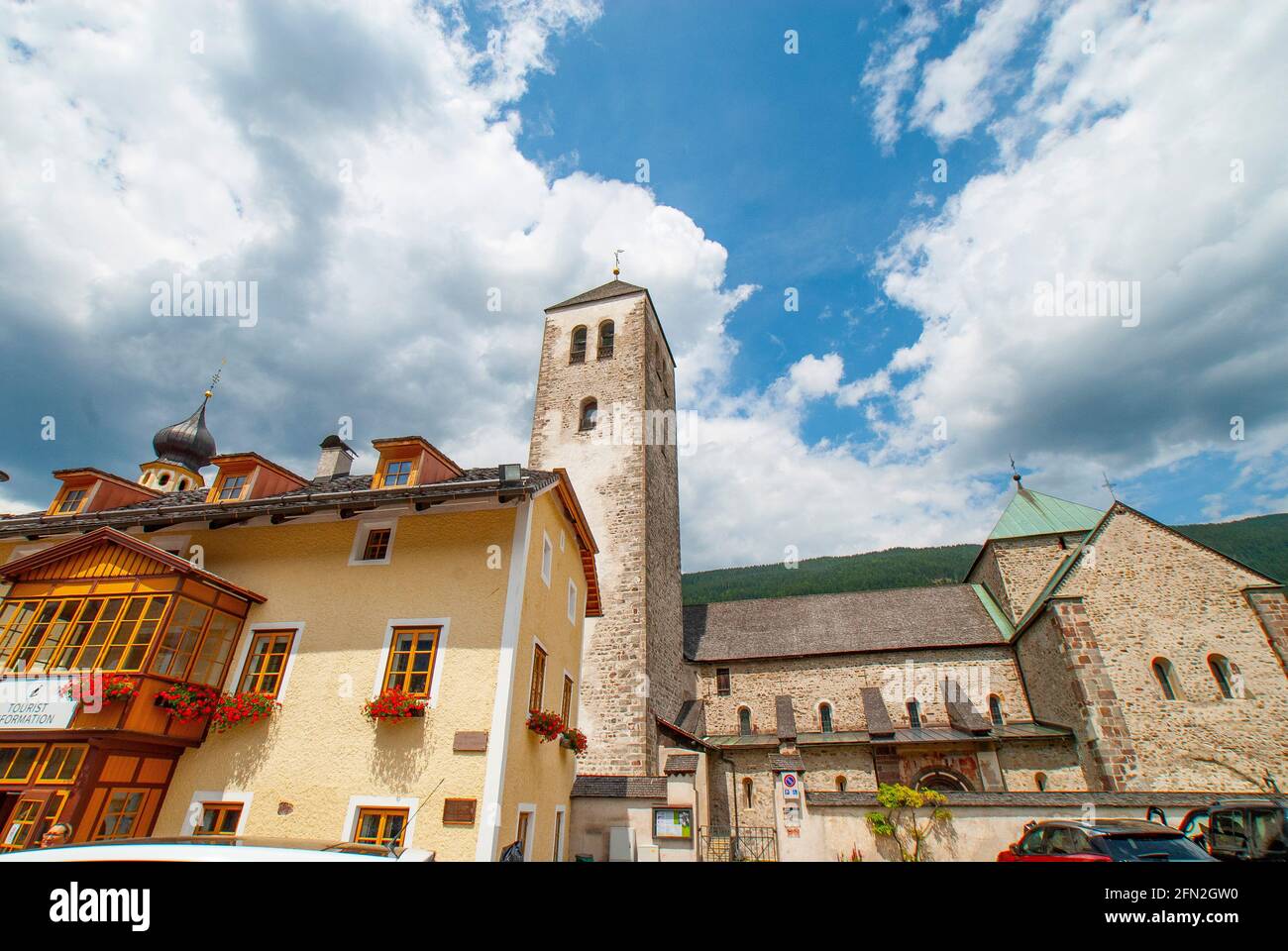 The Tourist Office and The Collegiate church of San Candido in the historic center of San Candido in Val Pusteria, Province of South Tyrol, Trentino-A Stock Photo