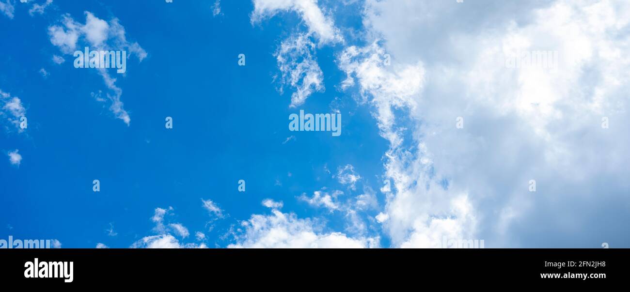 Stunning view of a blue sky with some fluffy clouds. Aerial shoot ...
