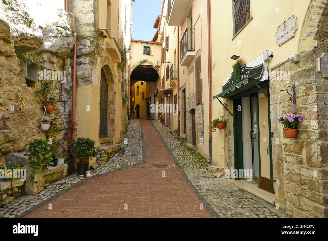 Sonnino, Italy, 05/10 / 2021. A street between old medieval stone buildings of a historic town in Lazio region, Italy. Stock Photo