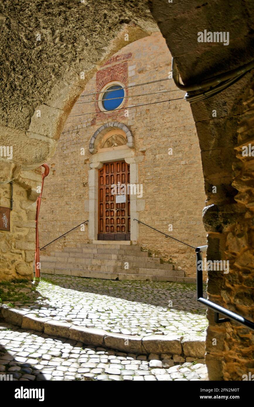 Sonnino, Italy, 05/10 / 2021. A street between old medieval stone buildings of a historic town in Lazio region, Italy. Stock Photo