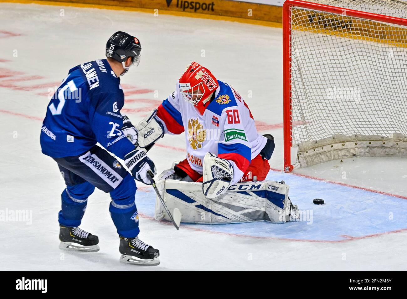 Prague, Czech Republic. 13th May, 2021. L-R Jere Karjalainen of Finland and Ivan Bocharov goalie of Russia in action during the Czech Hockey Games, Euro Hockey event Russia vs Finland