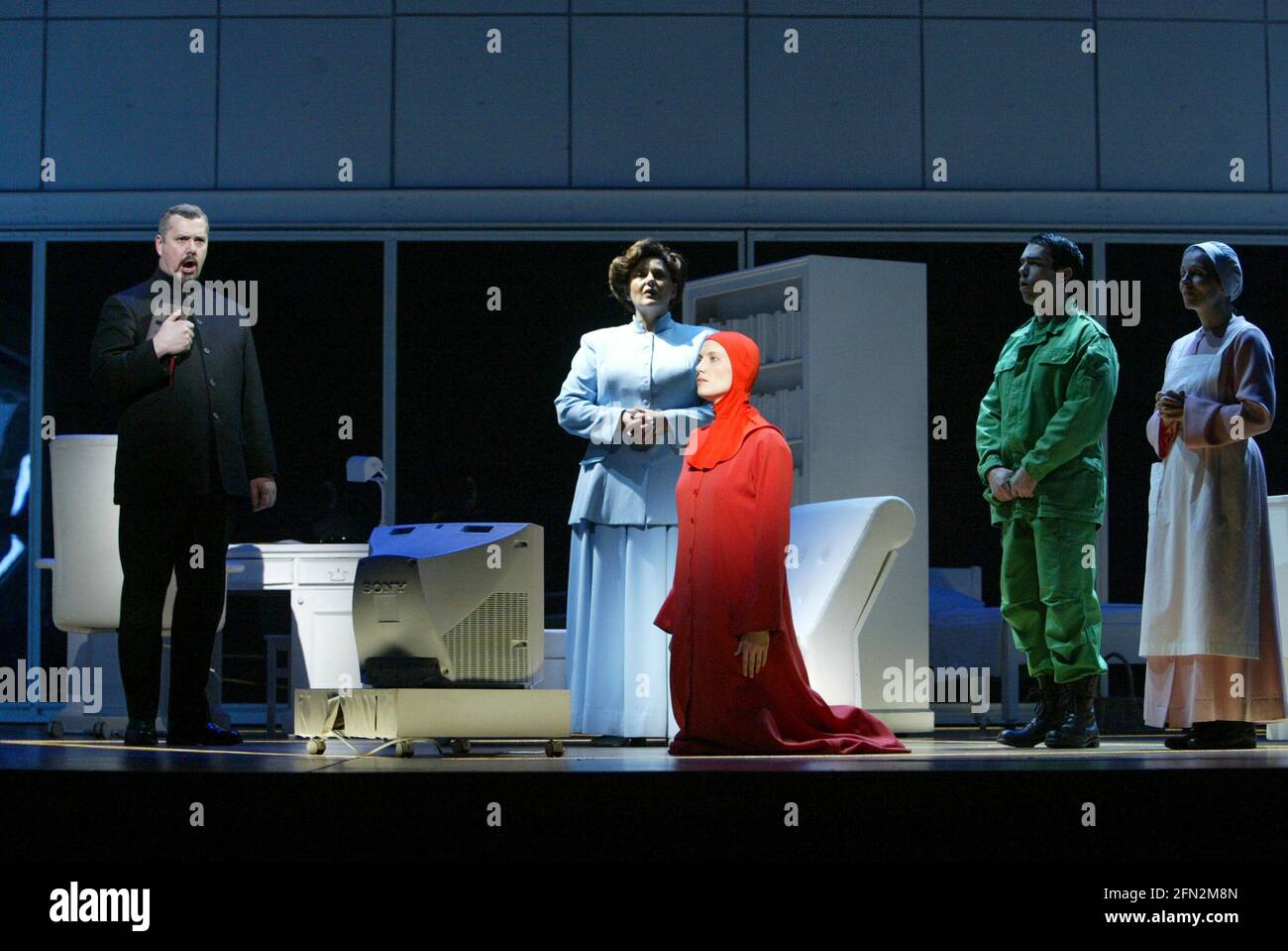 l-r: Stephen Richardson (The Commander), Catherine Wyn-Rogers (Serena Joy), Stephanie Marshall (Offred), Richard Coxon (Nick), Ethna Robinson (Rita) in THE HANDMAID'S TALE at English National Opera (ENO), London Coliseum, London WC2  03/04/2003  music: Poul Ruders  libretto: Paul Bentley after the novel by Margaret Atwood  conductor: Elgar Howarth  design: Peter McKintosh  lighting: Simon Mills  choreographer: Andrew George  director: Phyllida Lloyd Stock Photo