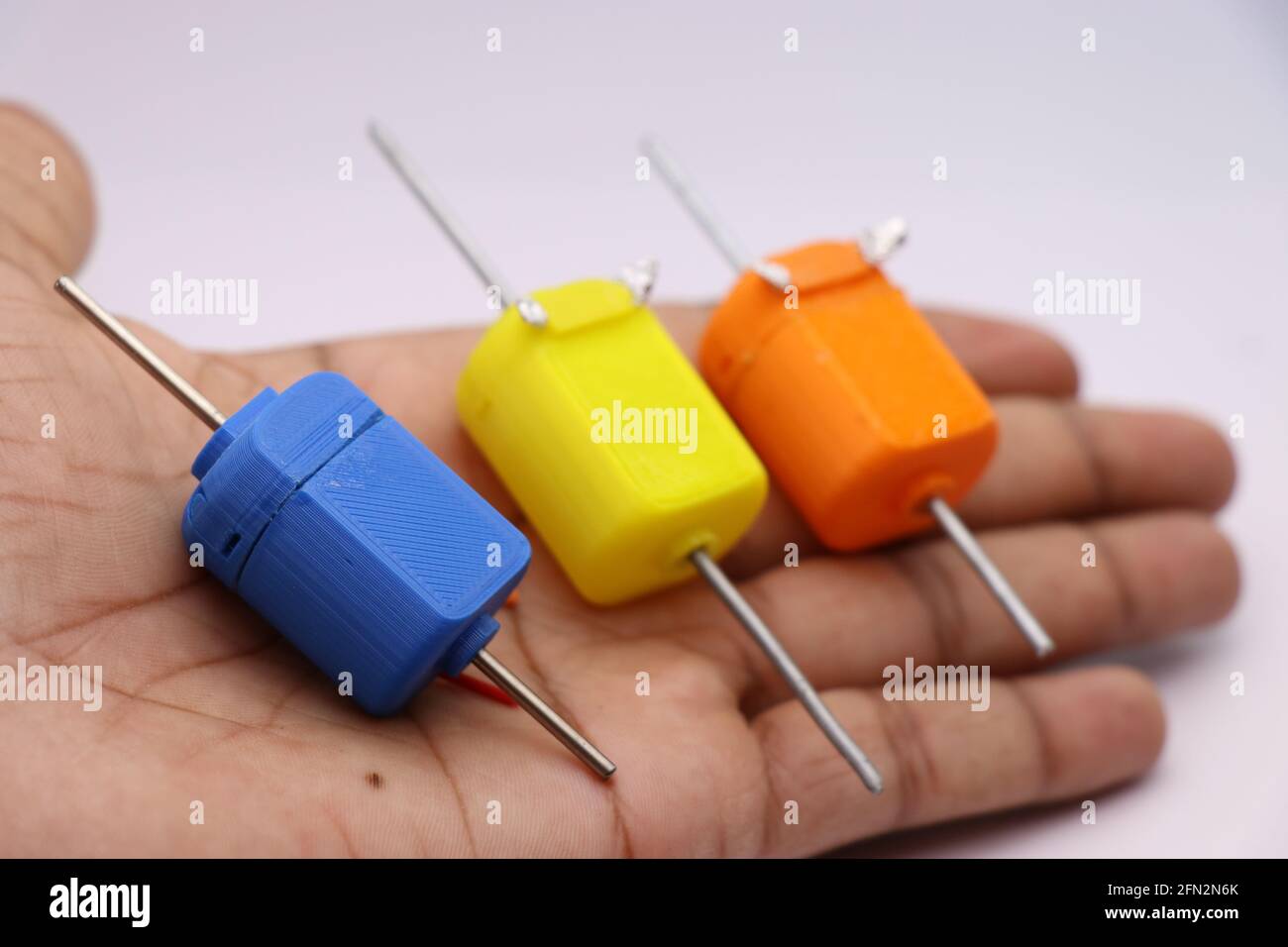 3D Printed Toy Dc Motor with Double Shaft. Two shaft toy dc motor having  shaft at either side use to make various hobby projects held in hand Stock  Photo - Alamy