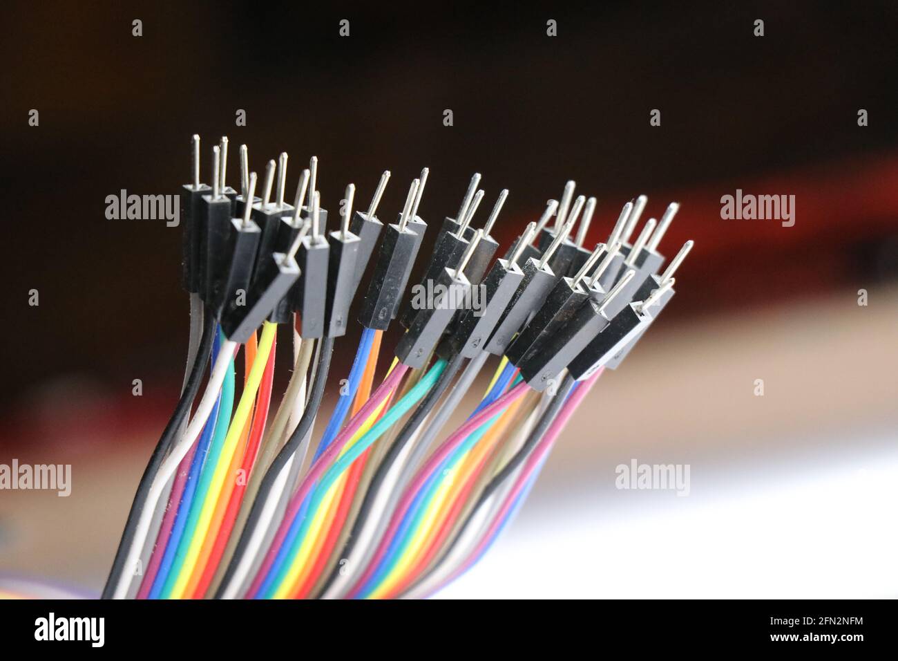 Jumper wires which is male type mainly used in making breadboard connections related to electronics projects, multicolor jumper wire Stock Photo