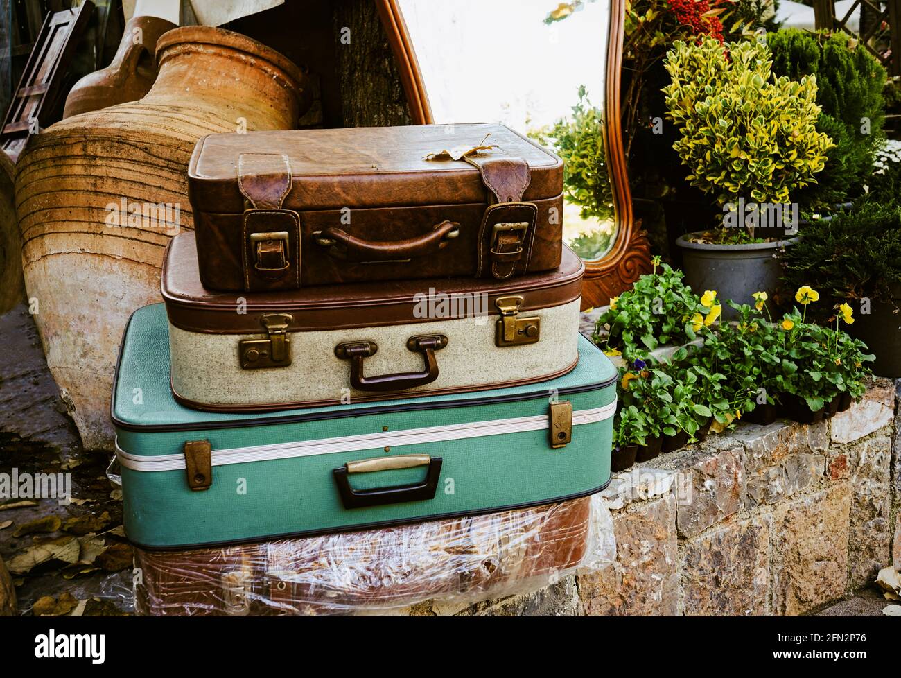Some old suitcases left at street. Vintage suitcases. Stock Photo