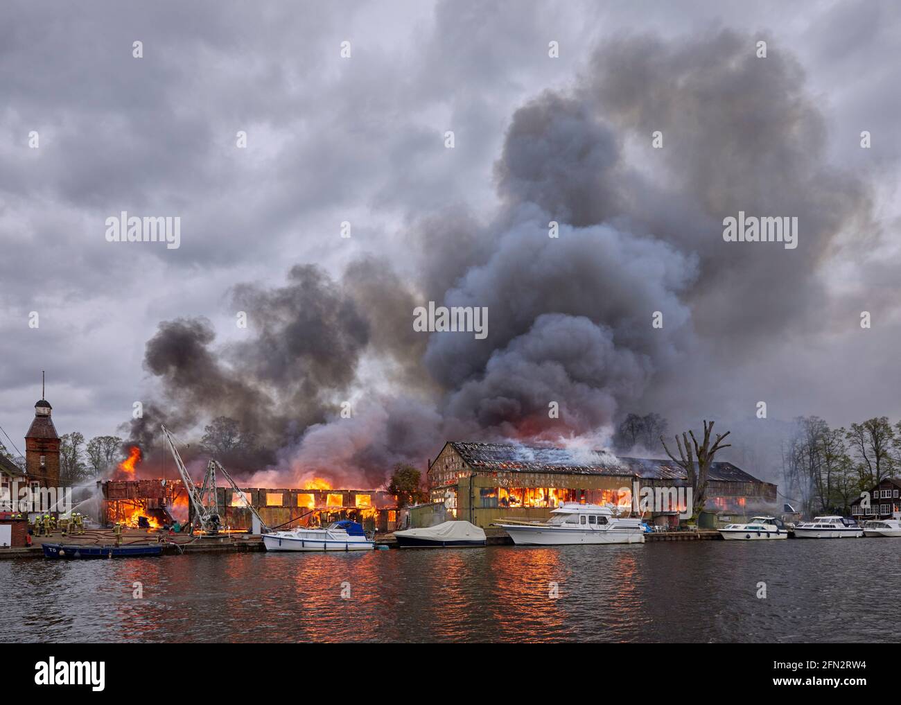 Platt's Eyot fire of 3 May 2021 which destroyed the boat shed of Otter Marine and the Dunkirk evacuation ship Lady Gay. The River Thames at Hampton, M Stock Photo
