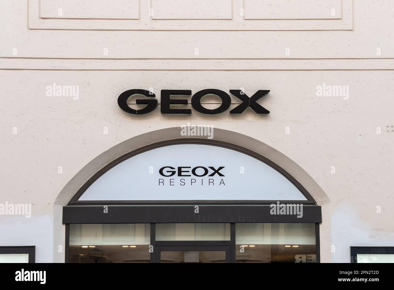 Geox store sign in Munich then center Stock Photo - Alamy