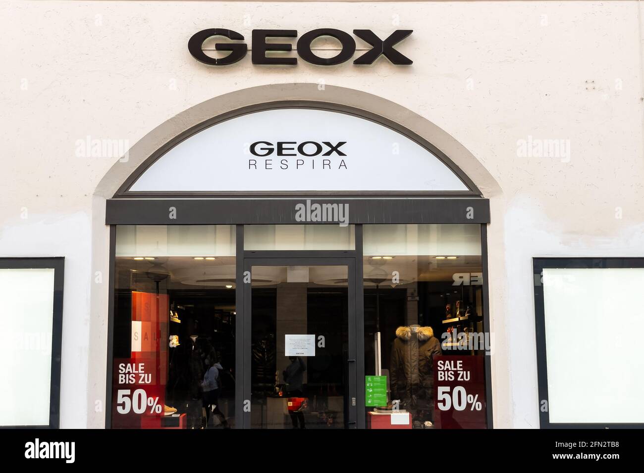 Geox store sign in Munich then center Stock Photo - Alamy
