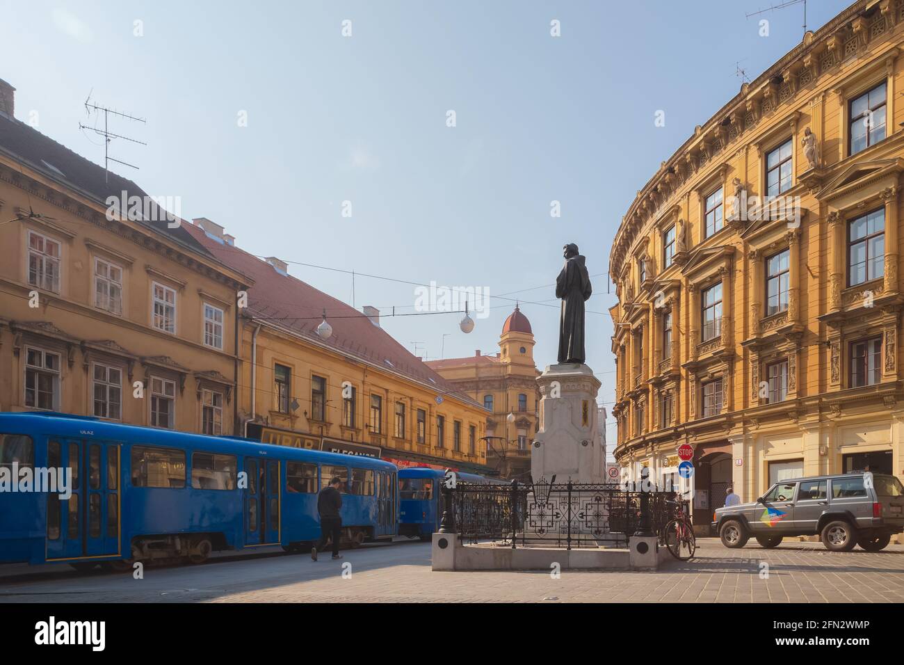 Zagreb, Croatia - October 7 2014: A tram and historic statue of poet Andrija Kacic on Ilica street in old town city centre of downtown Zagreb, capital Stock Photo