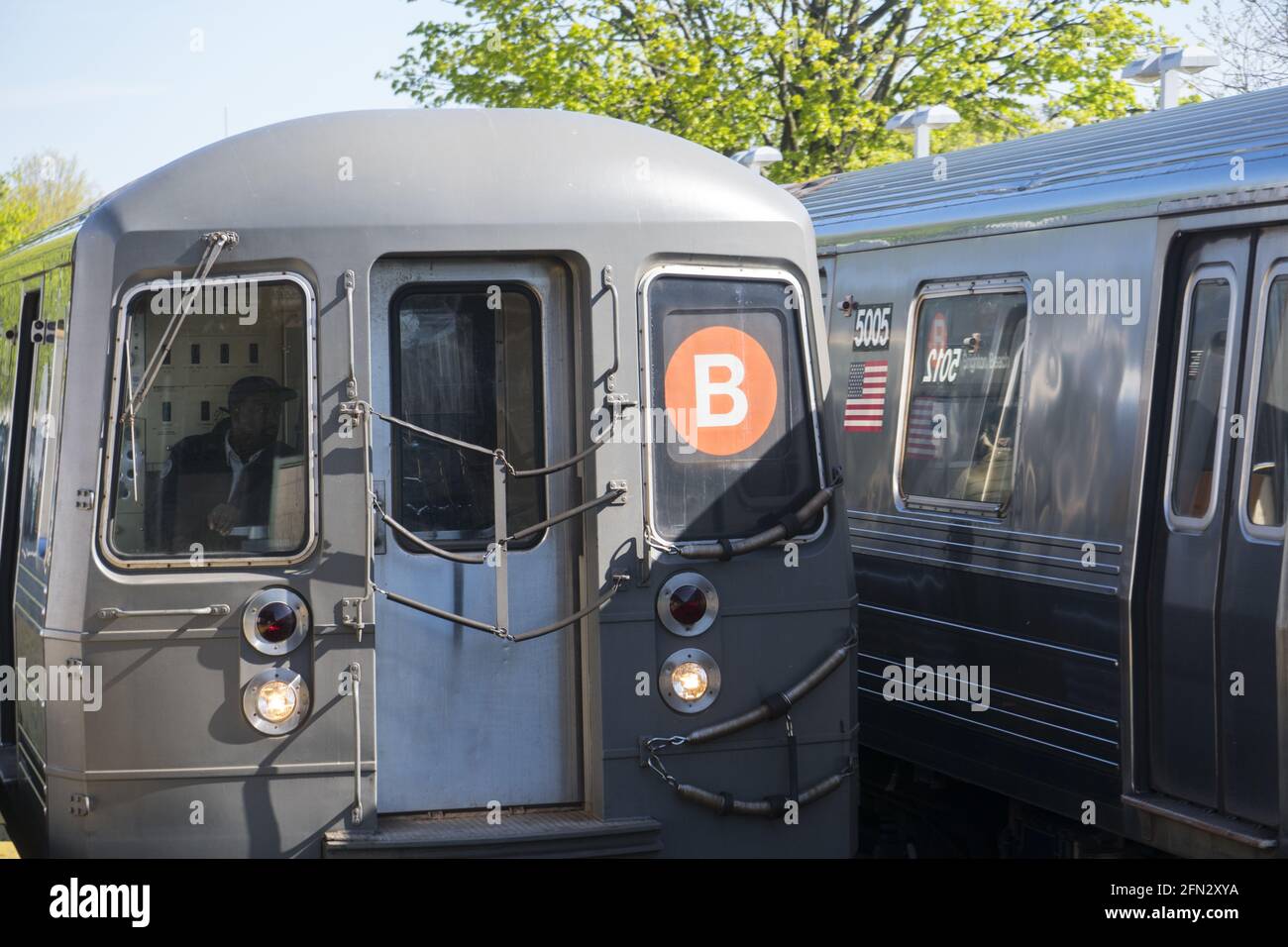 Outdoor elevated subway train enters the station at Kings Highway in