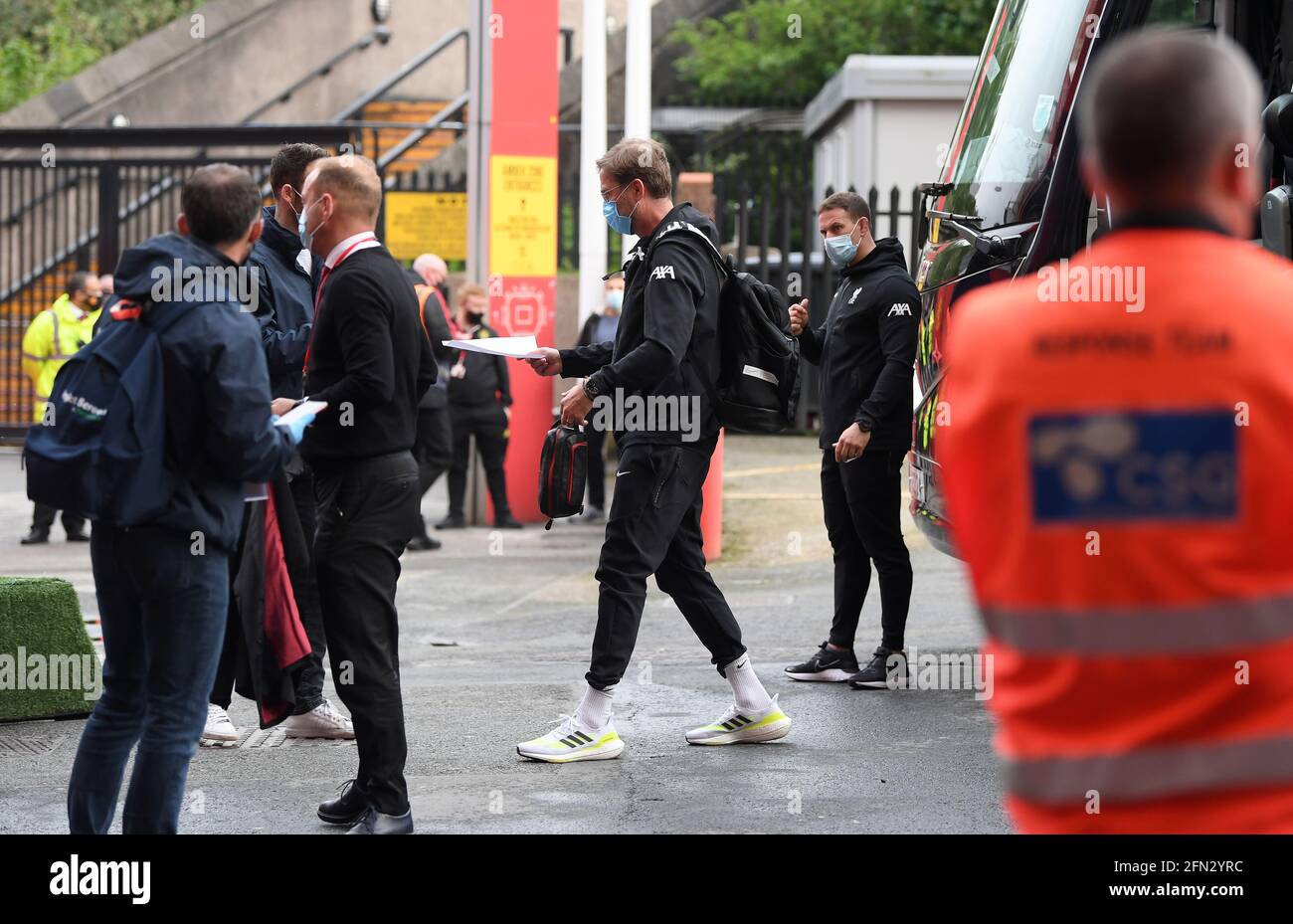 Liverpool manager Jurgen Klopp disembarks the team bus after arriving at the ground before the Premier League match at Old Trafford, Manchester. Picture date: Thursday May 13, 2021. Stock Photo
