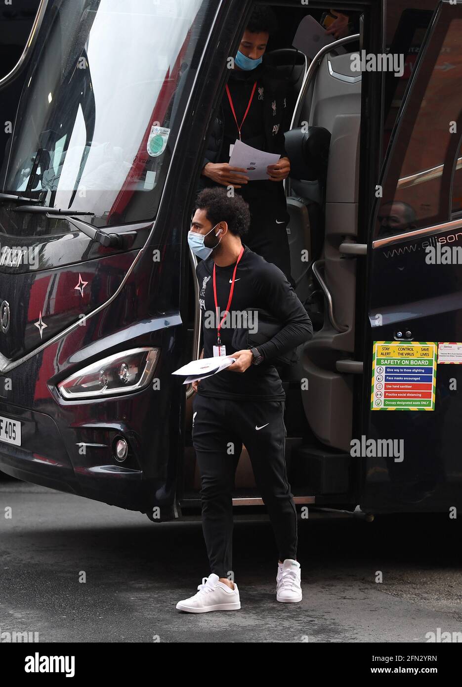 Liverpool's Mohamed Salah disembarks the team bus after arriving at the ground before the Premier League match at Old Trafford, Manchester. Picture date: Thursday May 13, 2021. Stock Photo