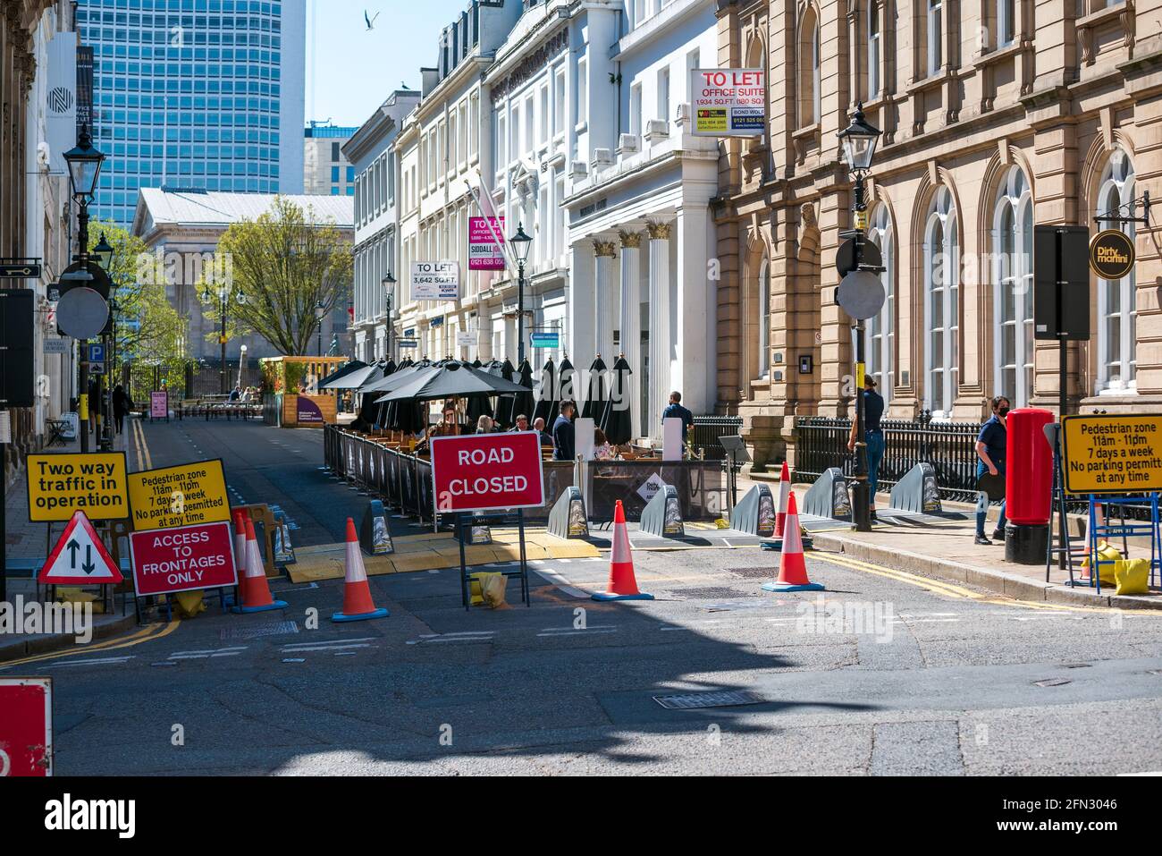 Road closed for COVID-19 social distancing and outdoor dining in Colmore Row, Birmingham city centre, UK Stock Photo
