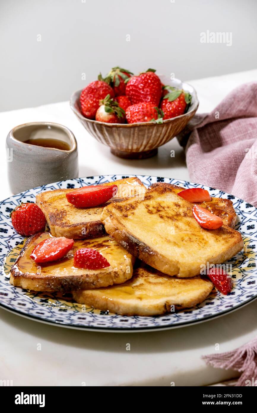 Stockpile of french toasts with fresh strawberries Stock Photo