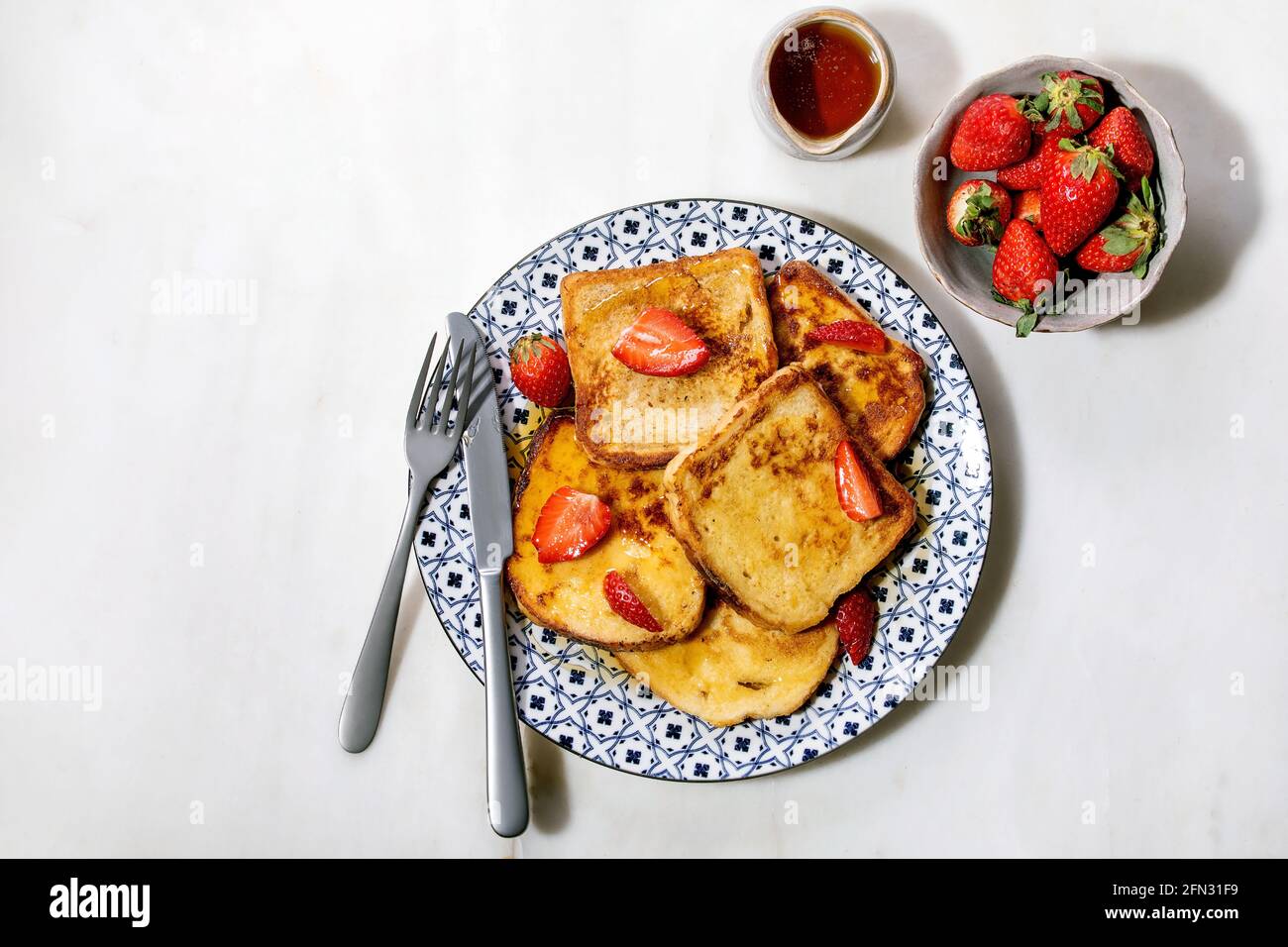 Stockpile of french toasts with fresh strawberries Stock Photo