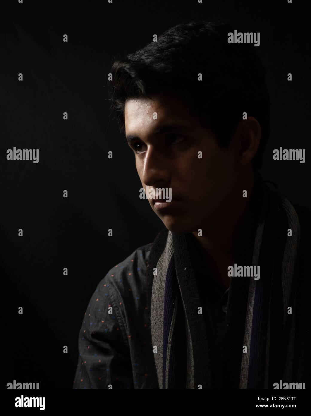 Handsome man on dark hi-res stock photography and images - Alamy