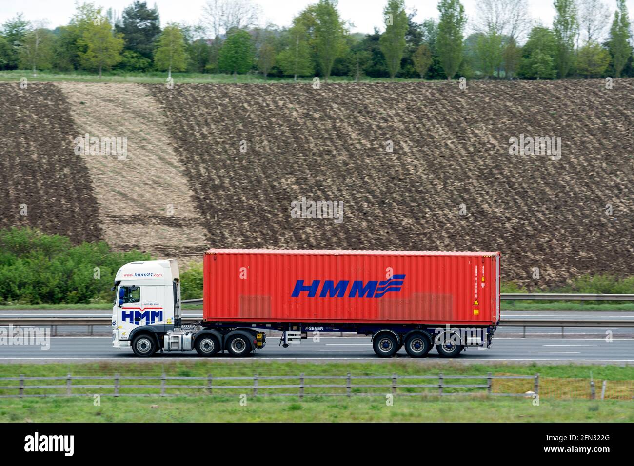 HMM shipping container lorry on the M40 motorway, Warwickshire, UK