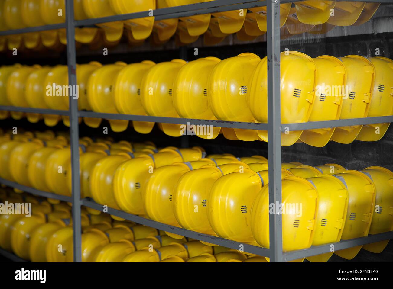 Yellow helmets hi-res stock photography and images - Alamy