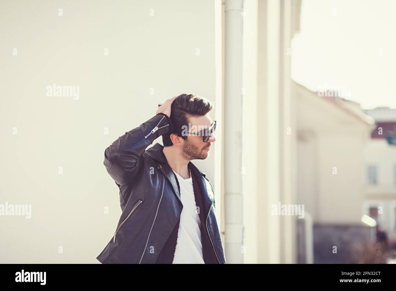 Man in black leather jacket hi-res stock photography and images - Alamy