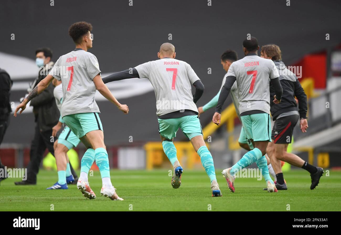 Liverpool players wearing t-shirts paying tribute to 9-year-old fan Jordan Banks in the warm up before the Premier League match at Old Trafford, Manchester. Picture date: Thursday May 13, 2021. Stock Photo