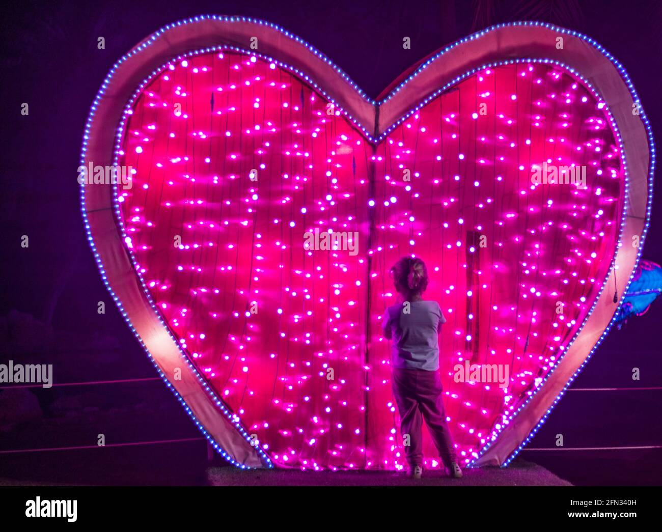 Illuminated installation in shape of heart Stock Photo Alamy