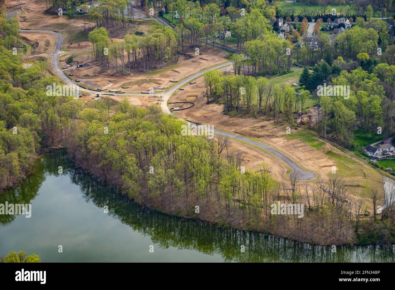 Land cleared with new road and cut de sac for new housing neighborhood development Stock Photo