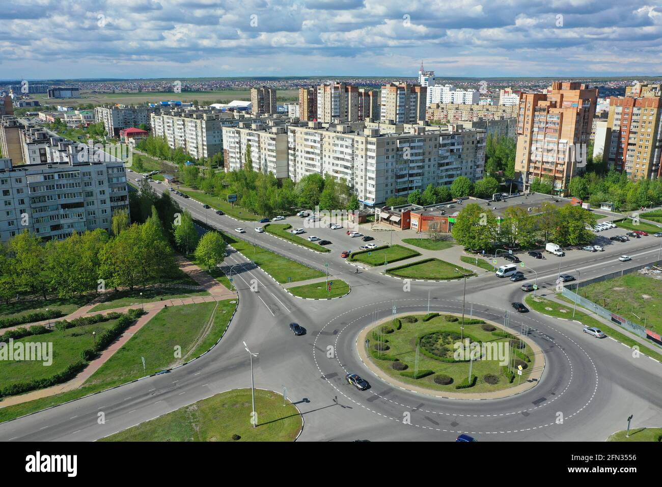 STARIY OSKOL, RUSSIA - MAY 12, 2021: Aerial view of the ring road and urban residential buildings Stock Photo