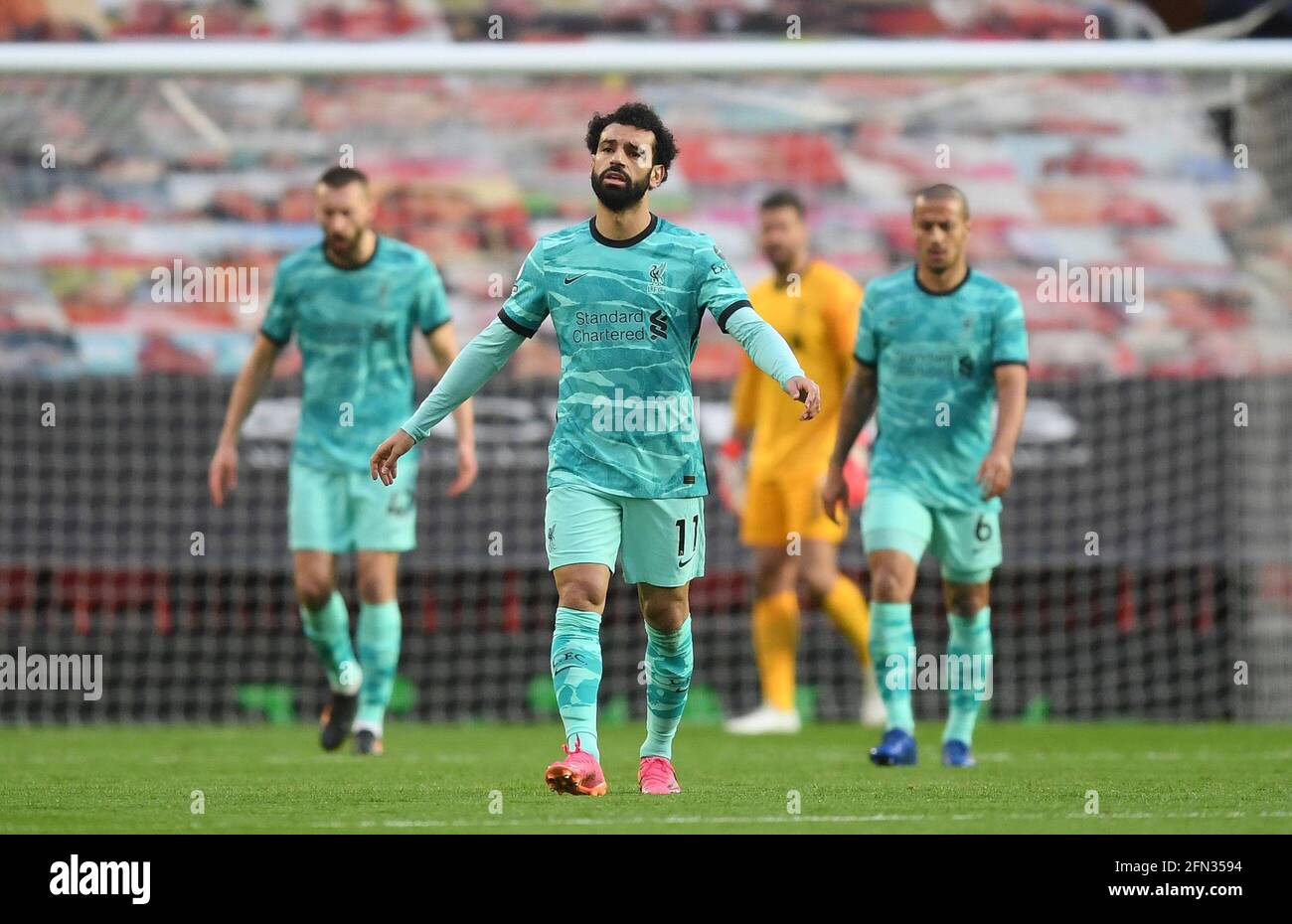 Liverpool's Mohamed Salah reacts after conceding the first goal during the Premier League match at Old Trafford, Manchester. Picture date: Thursday May 13, 2021. Stock Photo