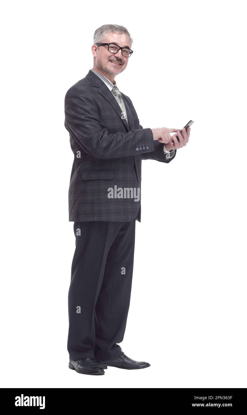 smiling elderly man talking on a smartphone . isolated on a white Stock Photo