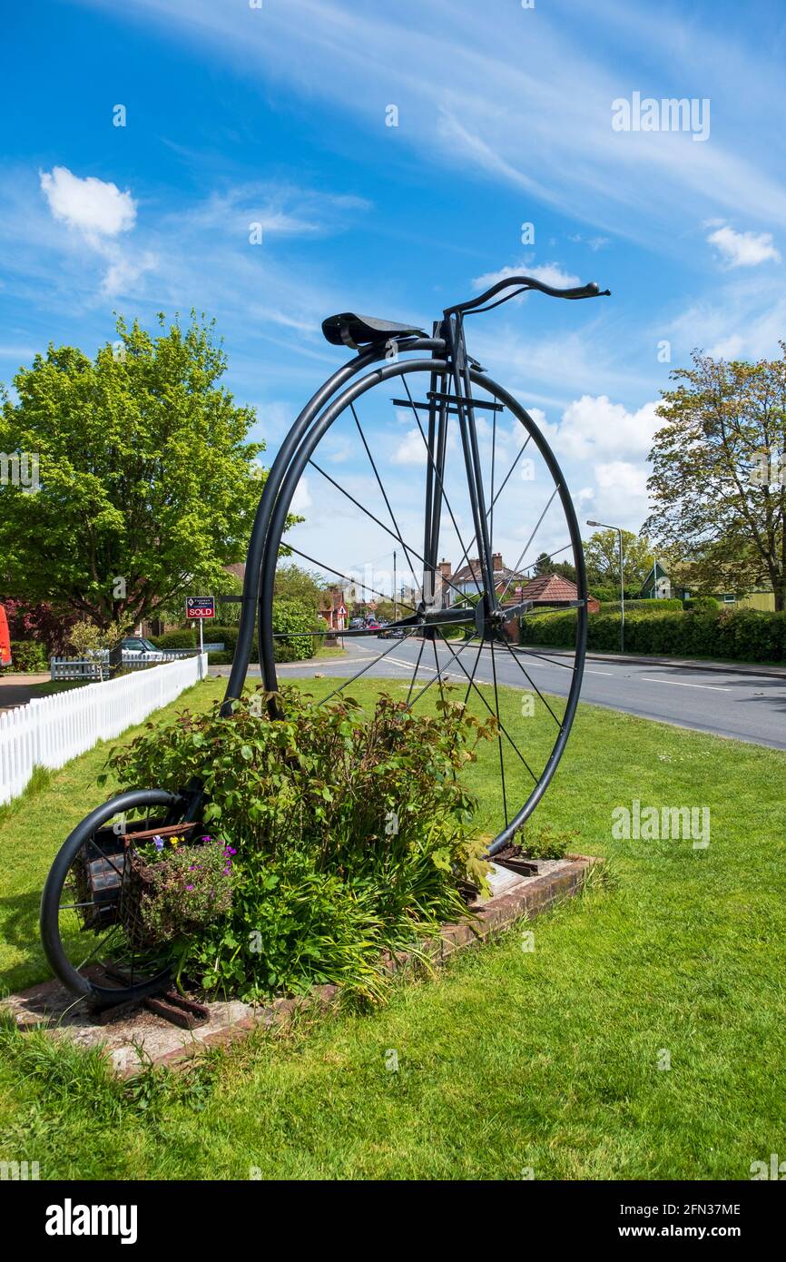 Giant Penny Farthing bicycle at the entrance to Sissinghurst Village, Kent, UK Stock Photo