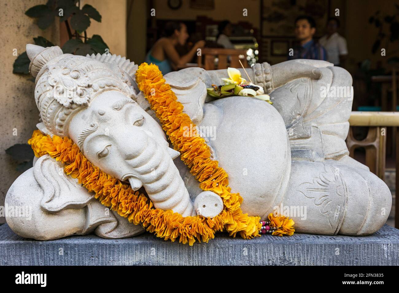 Reclining Ganesha figure with a lai, Ubud, Bali, Indonesia, Southeast Asia, Asia Stock Photo