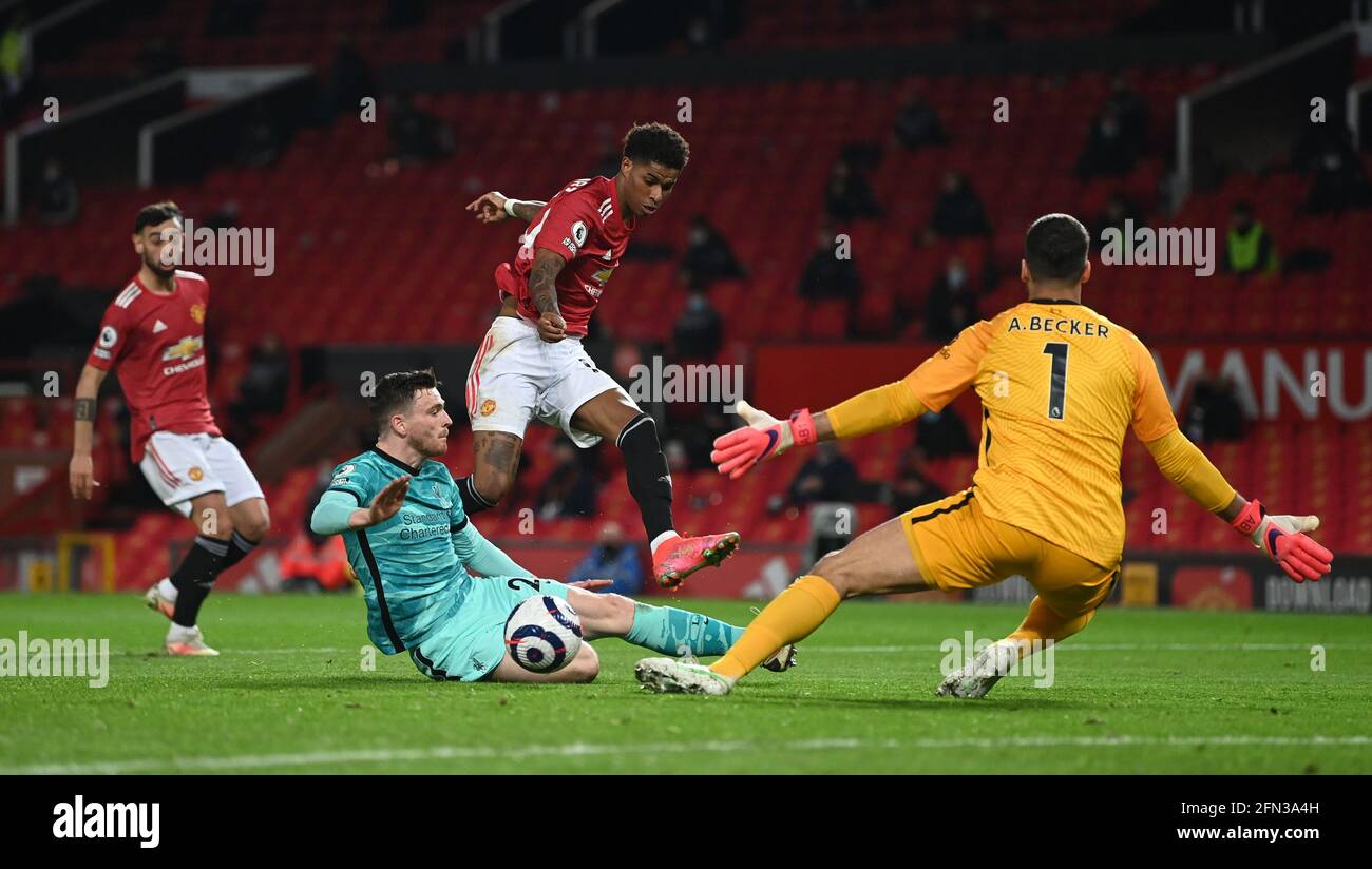 Manchester United's Marcus Rashford (right) scores their side's second goal of the game during the Premier League match at Old Trafford, Manchester. Picture date: Thursday May 13, 2021. Stock Photo