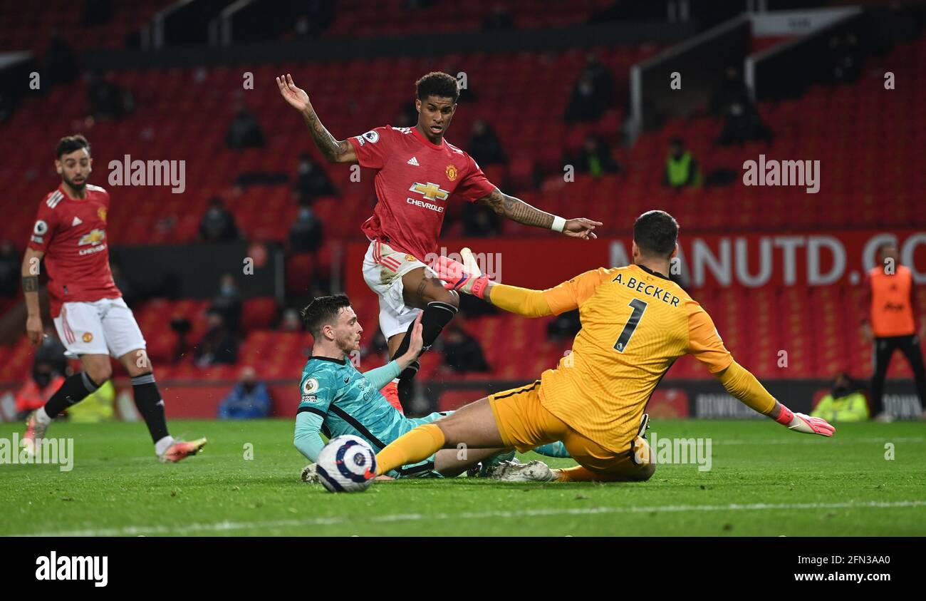 Manchester United's Marcus Rashford scores their side's second goal of the game during the Premier League match at Old Trafford, Manchester. Picture date: Thursday May 13, 2021. Stock Photo