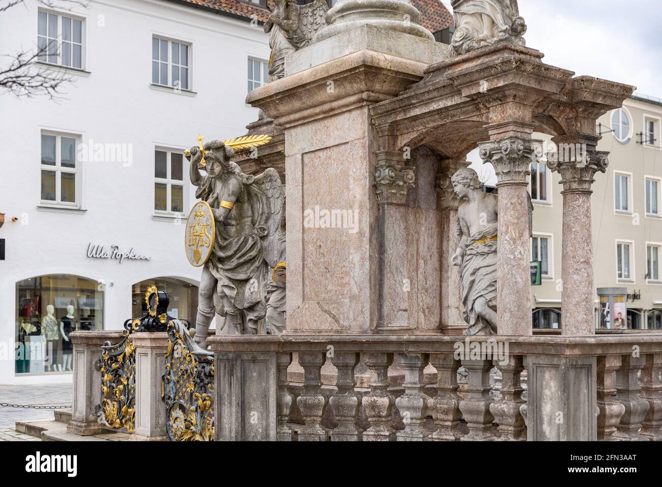 Historical gothic style statue and fountain in Bavarian city Straubing in Germany. Stock Photo